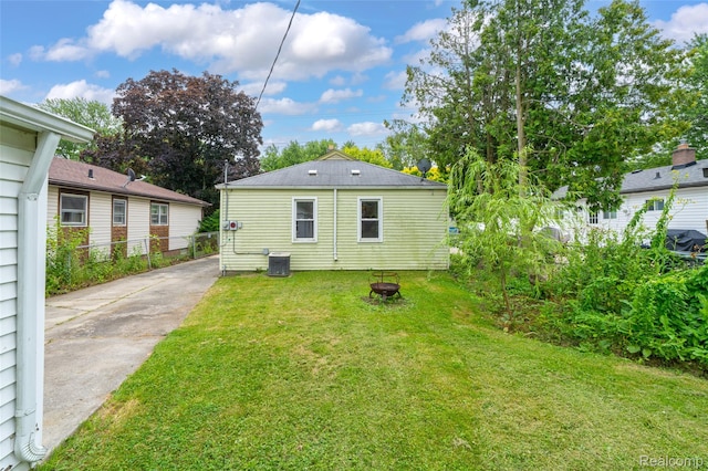 18379 Hazelwood St, Roseville, MI 48066 - back of house featuring a fire pit