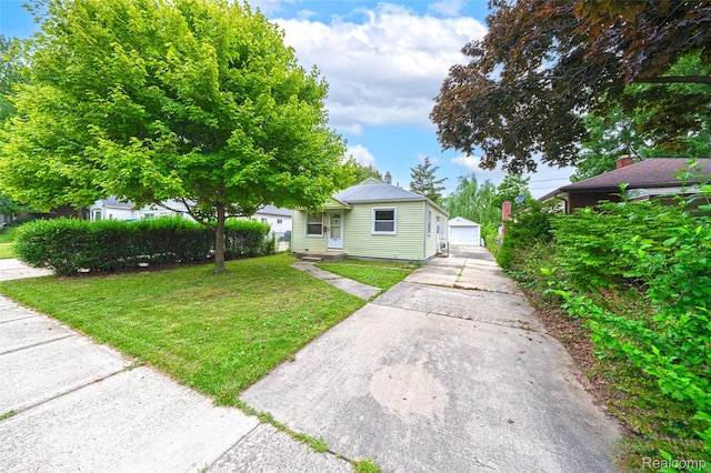 18379 Hazelwood St, Roseville, MI 48066 - view of front of house with a front lawn and an outdoor structure
