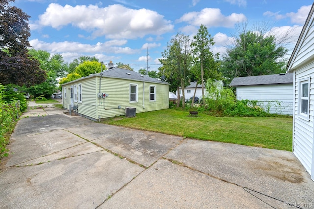 18379 Hazelwood St, Roseville, MI 48066 - back of property with a lawn and a patio