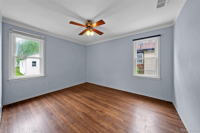 18379 Hazelwood St, Roseville, MI 48066 - empty room featuring wood-type flooring, plenty of natural light, a ceiling fan, and ornamental molding