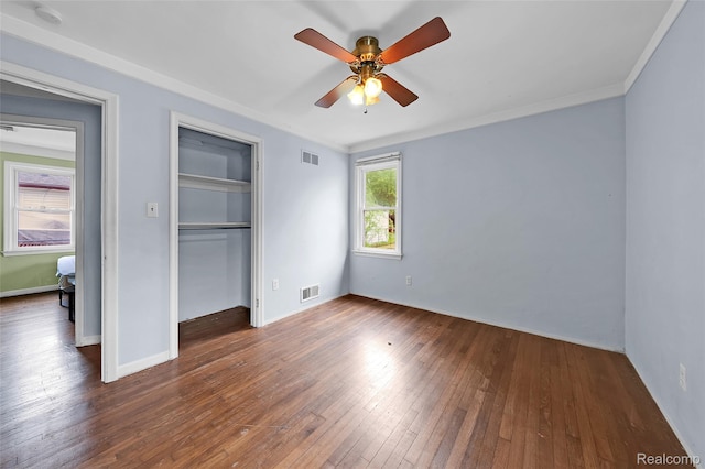 18379 Hazelwood St, Roseville, MI 48066 - unfurnished bedroom featuring wood-type flooring, a closet, ornamental molding, and ceiling fan