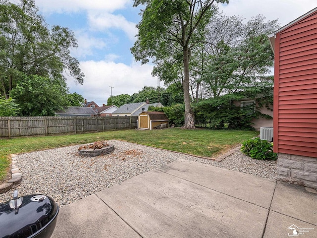5825 Edgewood Blvd, Monroe, MI 48161 - fenced backyard featuring a fire pit, a patio, and a shed