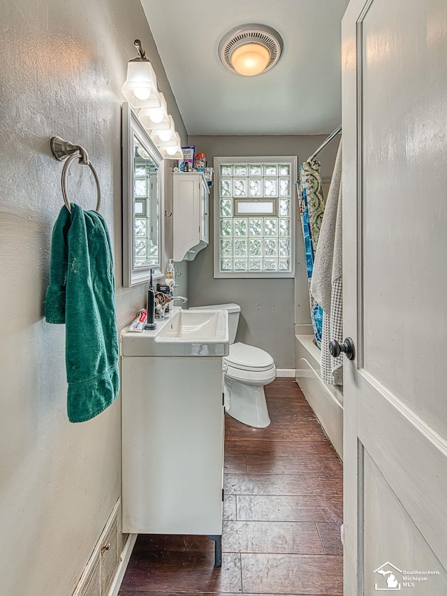 5825 Edgewood Blvd, Monroe, MI 48161 - full bathroom with hardwood / wood-style flooring, vanity, and shower / tub combo