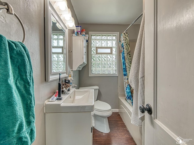 5825 Edgewood Blvd, Monroe, MI 48161 - bathroom with vanity, wood finished floors, and shower / bath combo with shower curtain