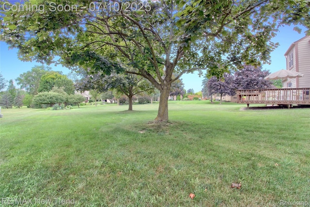 21905 Roxbury Dr, Novi, MI 48374 - view of grassy yard featuring a deck