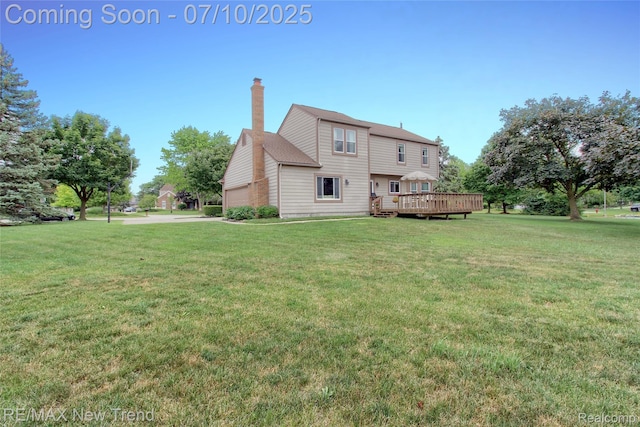 21905 Roxbury Dr, Novi, MI 48374 - back of house with a chimney, a yard, and a deck