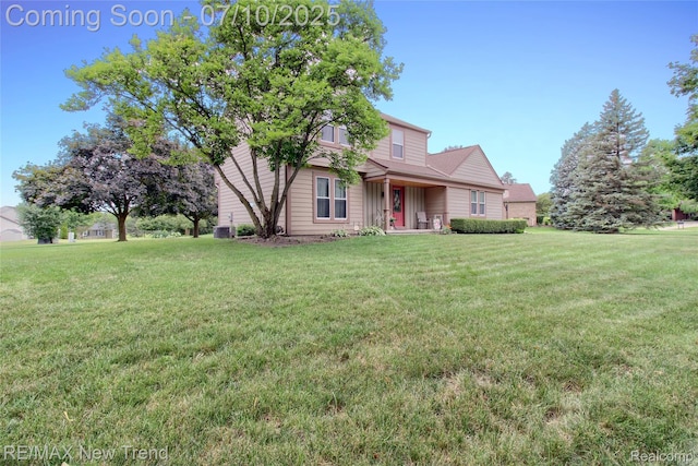 21905 Roxbury Dr, Novi, MI 48374 - view of front of property with a front yard and a porch
