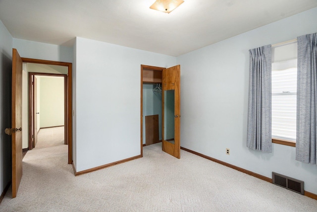 2329 Moon St, Muskegon, MI 49441 - unfurnished bedroom featuring light carpet and a closet