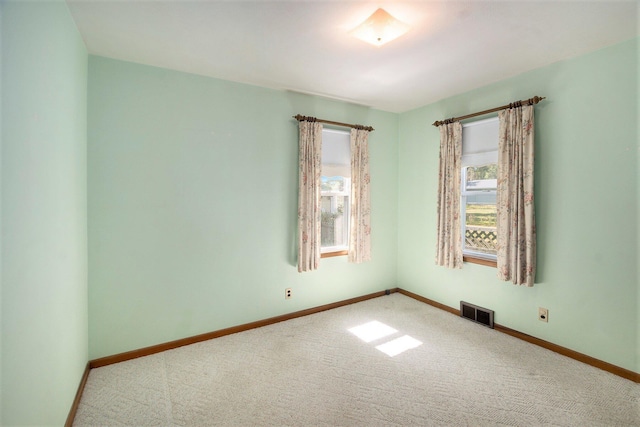 2329 Moon St, Muskegon, MI 49441 - carpeted spare room featuring baseboards