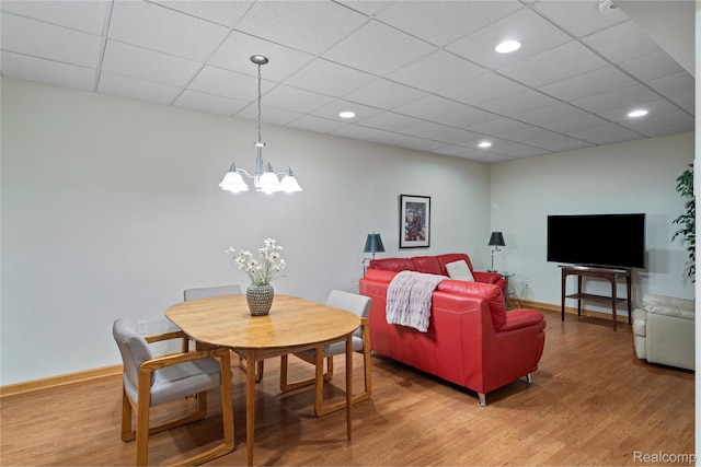12151 Vergennes St, Lowell, MI 49331 - dining space with a chandelier, light wood-type flooring, recessed lighting, and a paneled ceiling