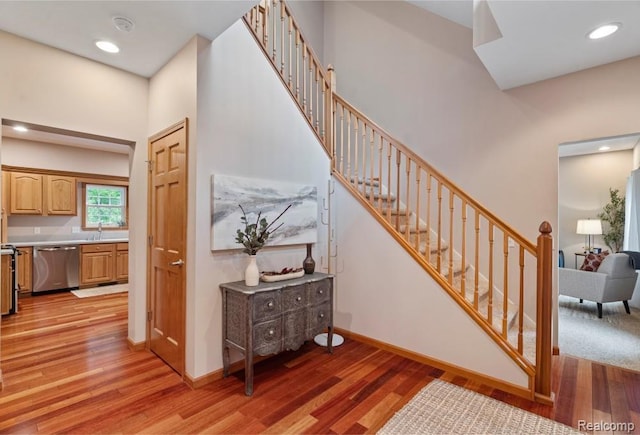12151 Vergennes St, Lowell, MI 49331 - stairs featuring wood finished floors and recessed lighting