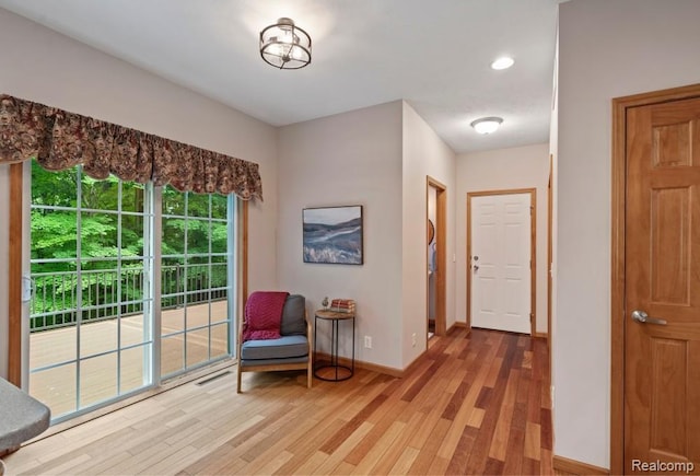 12151 Vergennes St, Lowell, MI 49331 - sitting room with light wood-style flooring and recessed lighting