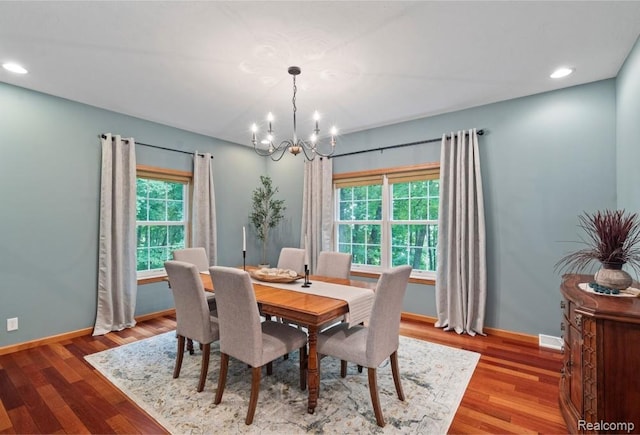 12151 Vergennes St, Lowell, MI 49331 - dining room with a chandelier, wood finished floors, and recessed lighting