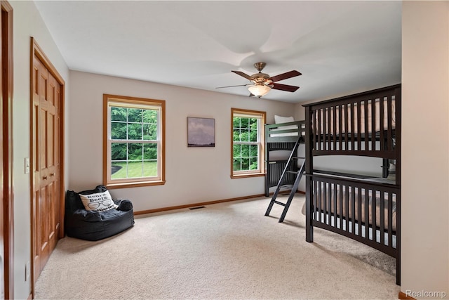 12151 Vergennes St, Lowell, MI 49331 - carpeted bedroom featuring a closet and ceiling fan