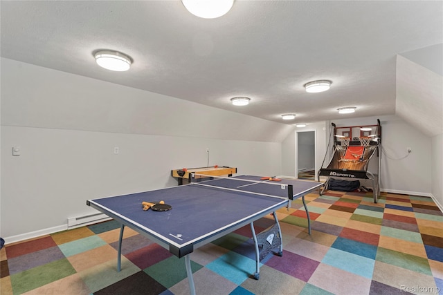 12151 Vergennes St, Lowell, MI 49331 - rec room with a baseboard radiator, lofted ceiling, tile patterned floors, and a textured ceiling