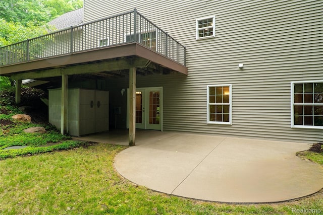 12151 Vergennes St, Lowell, MI 49331 - back of house featuring a patio, a wooden deck, and french doors