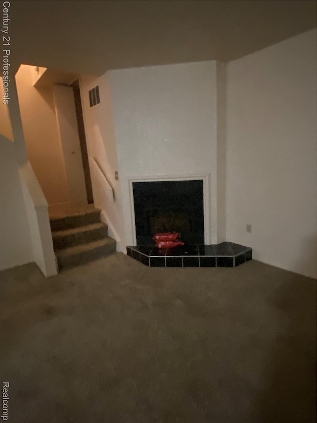 24857 Auburn Ln, Southfield, MI 48033 - unfurnished living room with a fireplace, carpet floors, and stairway