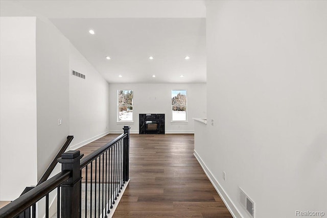 7268 Elizabeth Lake Rd, Waterford, MI 48327 - hall with dark wood-type flooring, recessed lighting, and an upstairs landing