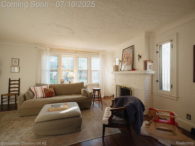 4858 Yorkshire Rd, Detroit, MI 48224 - living room with a textured ceiling, wood finished floors, and a brick fireplace