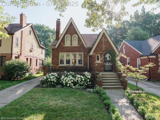 4858 Yorkshire Rd, Detroit, MI 48224 - tudor-style house with brick siding, a front lawn, and a chimney