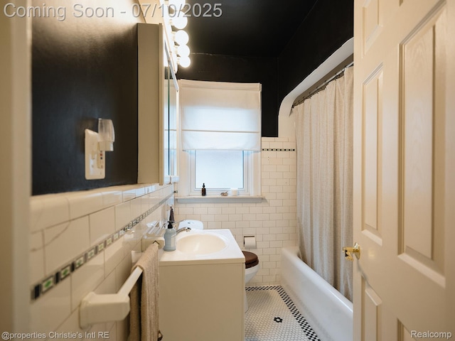 4858 Yorkshire Rd, Detroit, MI 48224 - full bathroom featuring tile walls, vanity, tile patterned flooring, and shower / tub combo