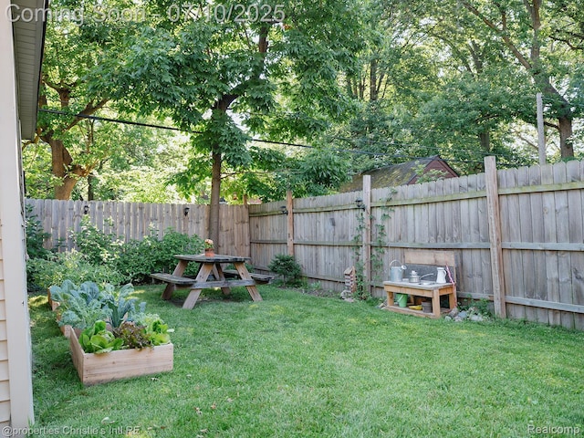 4858 Yorkshire Rd, Detroit, MI 48224 - fenced backyard with a vegetable garden