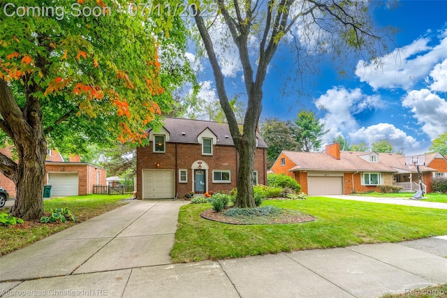 27461 Goldengate Dr W, Lathrup Village, MI 48076 - traditional home featuring concrete driveway, brick siding, and a garage