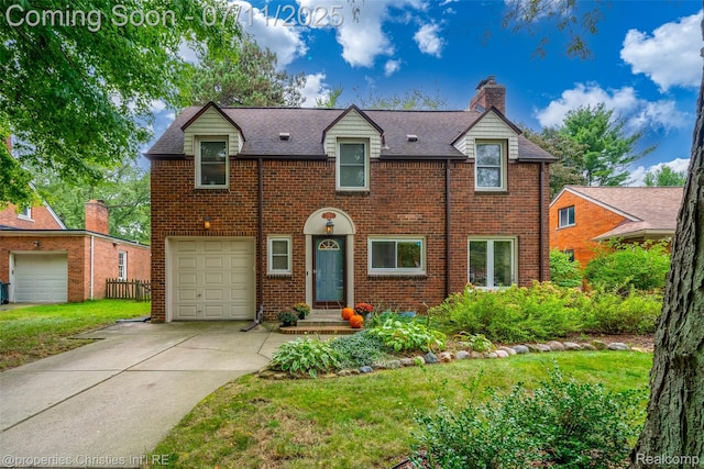 27461 Goldengate Dr W, Lathrup Village, MI 48076 - view of front facade with a chimney, concrete driveway, a garage, brick siding, and a shingled roof