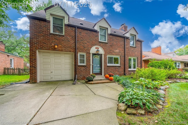 27461 Goldengate Dr W, Lathrup Village, MI 48076 - view of front facade featuring brick siding, driveway, a garage, and a shingled roof