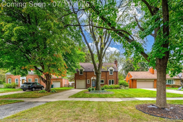 27461 Goldengate Dr W, Lathrup Village, MI 48076 - view of front of property with brick siding, concrete driveway, a front yard, a chimney, and an attached garage