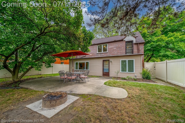 27461 Goldengate Dr W, Lathrup Village, MI 48076 - back of house featuring a patio, a fenced backyard, an outdoor fire pit, and brick siding