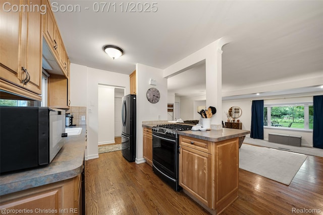 27461 Goldengate Dr W, Lathrup Village, MI 48076 - kitchen with black appliances, dark wood-style floors, dark countertops, and open floor plan