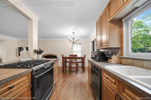 27461 Goldengate Dr W, Lathrup Village, MI 48076 - kitchen with gas range, dishwasher, light wood-type flooring, healthy amount of natural light, and crown molding