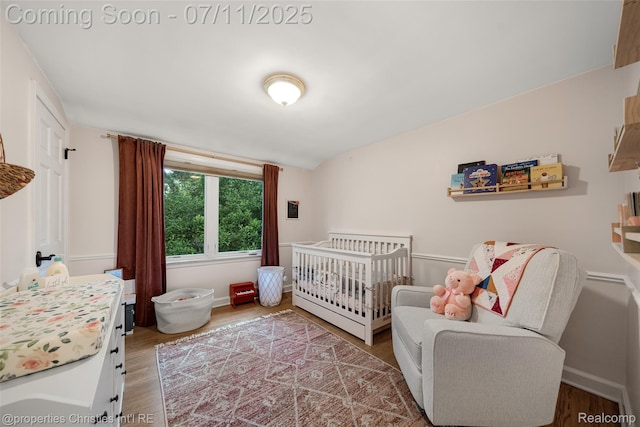 27461 Goldengate Dr W, Lathrup Village, MI 48076 - bedroom with wood finished floors and a nursery area