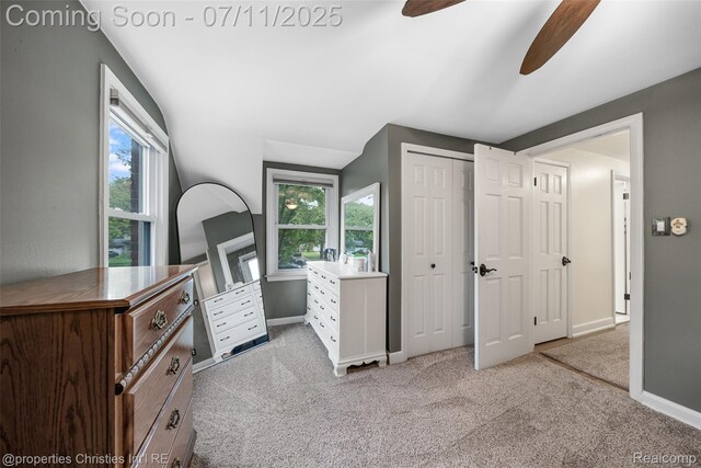 27461 Goldengate Dr W, Lathrup Village, MI 48076 - unfurnished bedroom with light carpet, multiple windows, a ceiling fan, and a closet
