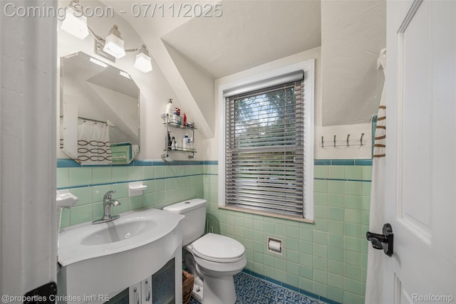 27461 Goldengate Dr W, Lathrup Village, MI 48076 - bathroom featuring tile walls, tile patterned flooring, vanity, and a wainscoted wall