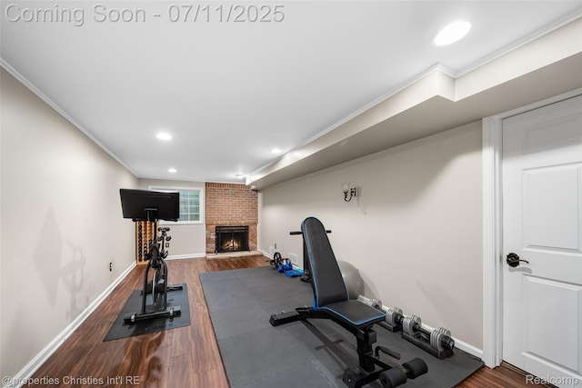 27461 Goldengate Dr W, Lathrup Village, MI 48076 - exercise area featuring ornamental molding, a fireplace, wood finished floors, and recessed lighting