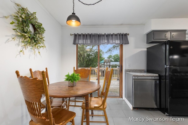 4172 Ranchero Dr, Dorr, MI 49323 - dining room featuring light tile patterned floors and crown molding