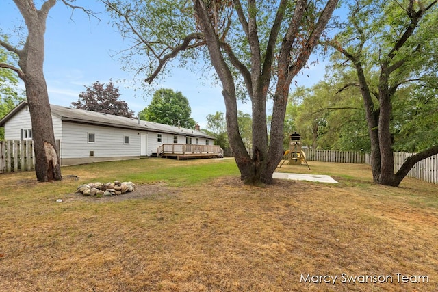 4172 Ranchero Dr, Dorr, MI 49323 - fenced backyard with a playground and a deck