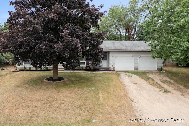 4172 Ranchero Dr, Dorr, MI 49323 - view of front of property featuring driveway, a garage, and a front yard