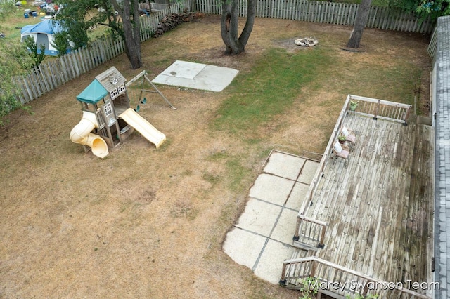 4172 Ranchero Dr, Dorr, MI 49323 - fenced backyard featuring a playground