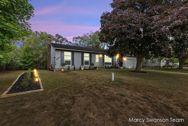 4172 Ranchero Dr, Dorr, MI 49323 - single story home with a chimney, an attached garage, a garden, and driveway