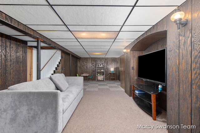 4172 Ranchero Dr, Dorr, MI 49323 - living area with wooden walls, carpet flooring, stairway, and a drop ceiling