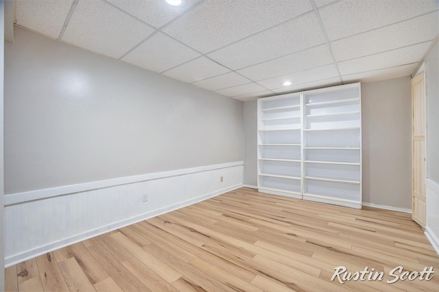 2953-2955 Okemos Dr SE, Grand Rapids, MI 49546 - empty room featuring wood finished floors, a paneled ceiling, wainscoting, and recessed lighting