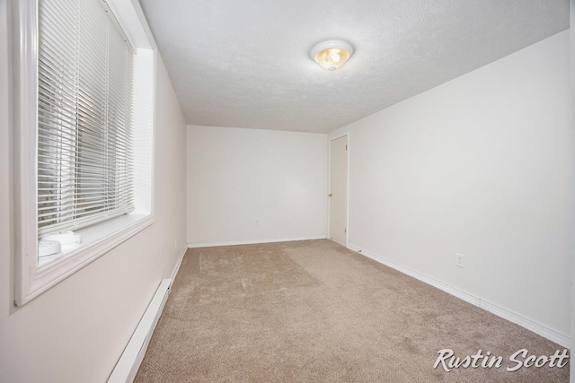 2953-2955 Okemos Dr SE, Grand Rapids, MI 49546 - carpeted spare room featuring baseboard heating and a textured ceiling