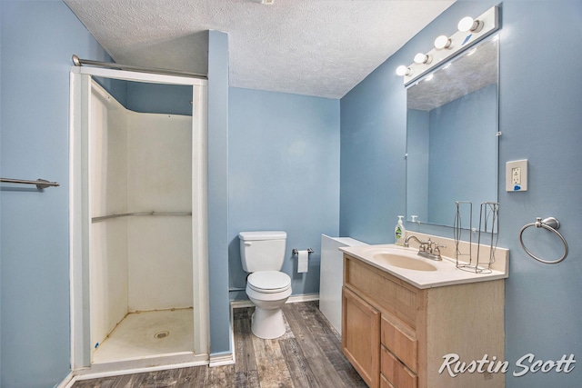 2953-2955 Okemos Dr SE, Grand Rapids, MI 49546 - full bathroom with wood finished floors, vanity, a shower stall, and a textured ceiling