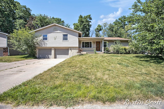 2953-2955 Okemos Dr SE, Grand Rapids, MI 49546 - tri-level home featuring an attached garage, a front yard, concrete driveway, and a porch