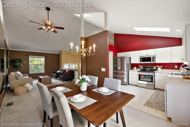 6873 Fox Ln, Waterford, MI 48327 - dining room featuring high vaulted ceiling, ceiling fan, a chandelier, and recessed lighting