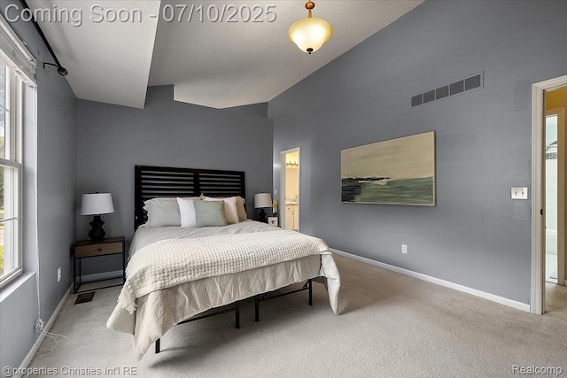 6873 Fox Ln, Waterford, MI 48327 - carpeted bedroom featuring lofted ceiling and connected bathroom