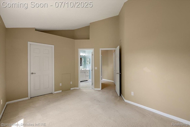 6873 Fox Ln, Waterford, MI 48327 - unfurnished bedroom with carpet flooring, lofted ceiling, and ensuite bath